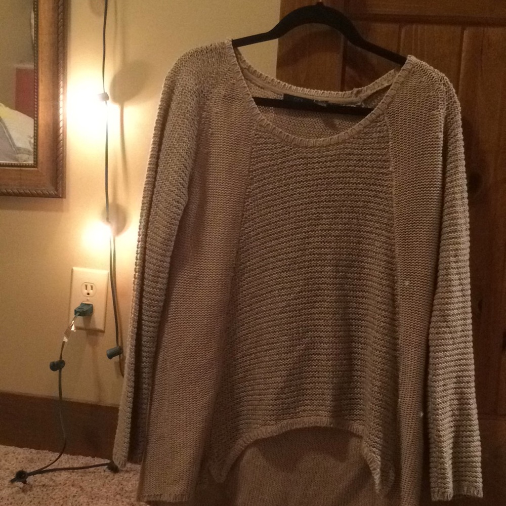 A Tan and black sweater